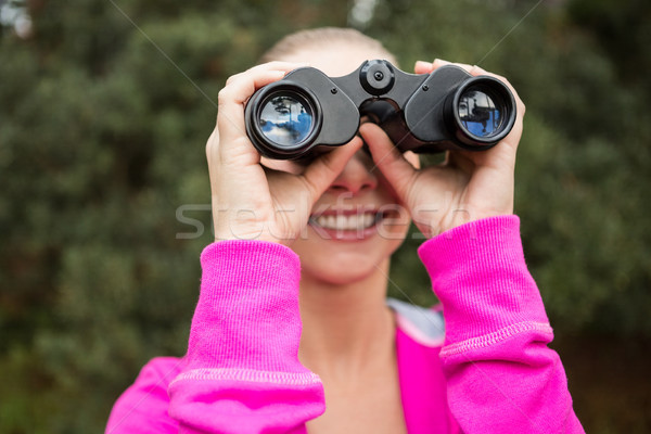 Female hiker looking through the binoculars Stock photo © wavebreak_media