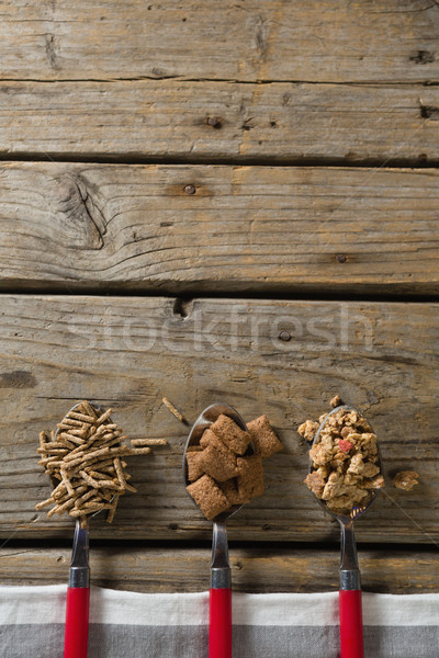 Stock photo: Three spoons with various breakfast cereals