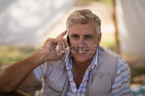 Happy man talking on mobile phone Stock photo © wavebreak_media