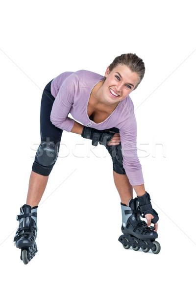 Portrait of happy woman inline skating Stock photo © wavebreak_media