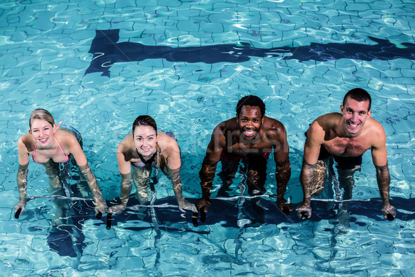 Fit smiling group pedaling on swimming bike Stock photo © wavebreak_media