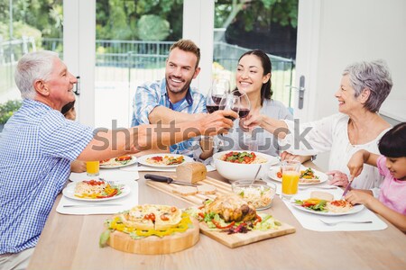 Table à manger souriant femme maison [[stock_photo]] © wavebreak_media