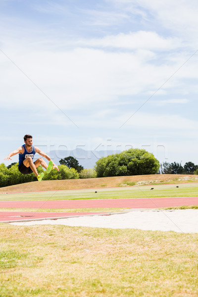 選手 長い ジャンプ 男 フィールド ストックフォト © wavebreak_media