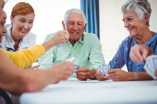 Lächelnd Krankenschwester Senioren Menschen Spielkarten Altenheim Stock foto © wavebreak_media