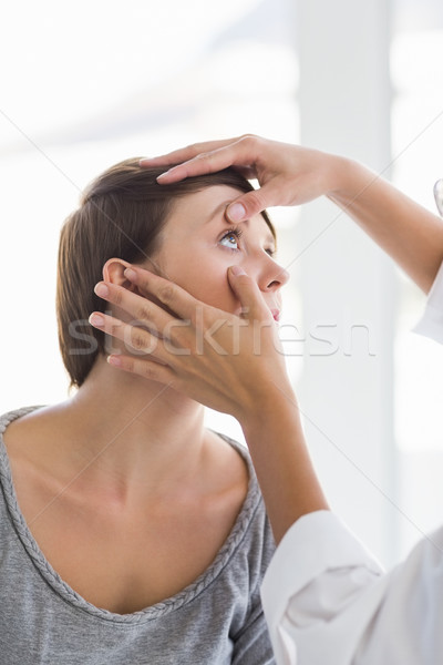 Cropped image of doctor checking woman eye Stock photo © wavebreak_media