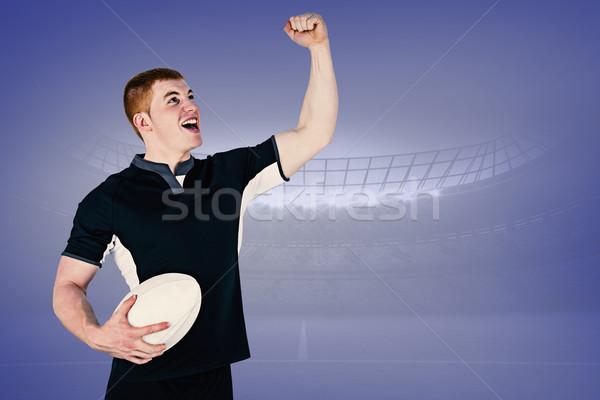 Stock photo: Composite image of a rugby player gesturing victory
