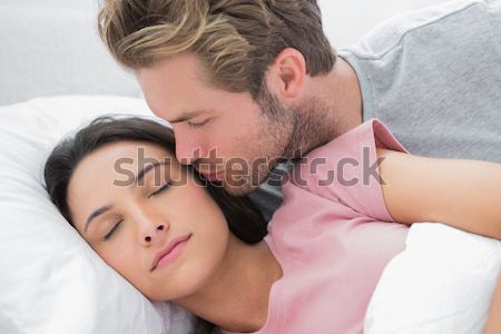 Intimate couple in bed Stock photo © wavebreak_media