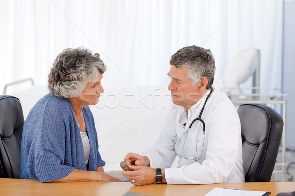 A senior doctor with his patient in his office Stock photo © wavebreak_media