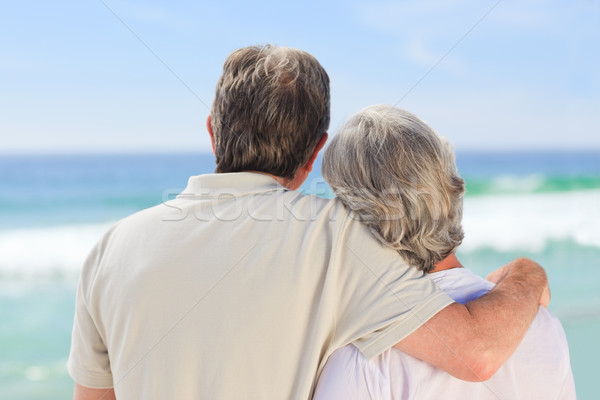 Pareja de ancianos mirando mar feliz caminando femenino Foto stock © wavebreak_media