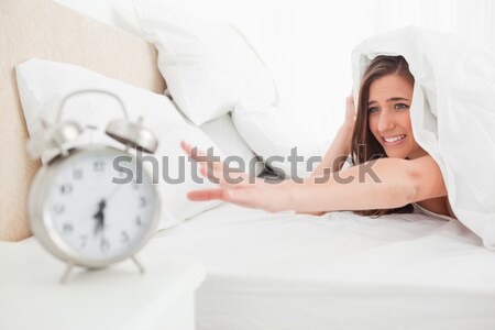 Zmęczony kobieta sypialni ręce bed głowie Zdjęcia stock © wavebreak_media