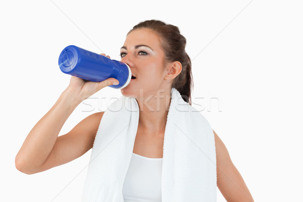 Sporty female taking a sip of water after workout against a white background Stock photo © wavebreak_media