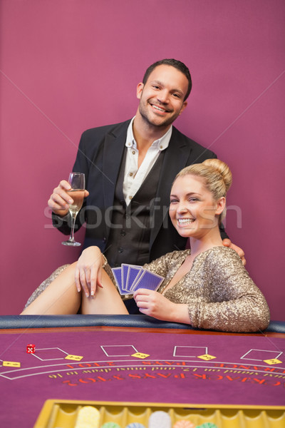 Szczęśliwy para poker tabeli kasyno kobieta Zdjęcia stock © wavebreak_media