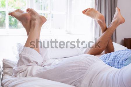 Jeune femme jambes lit maison sexy [[stock_photo]] © wavebreak_media