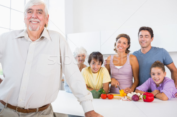 Stock photo: Grandfather standing beside counter in kitchen