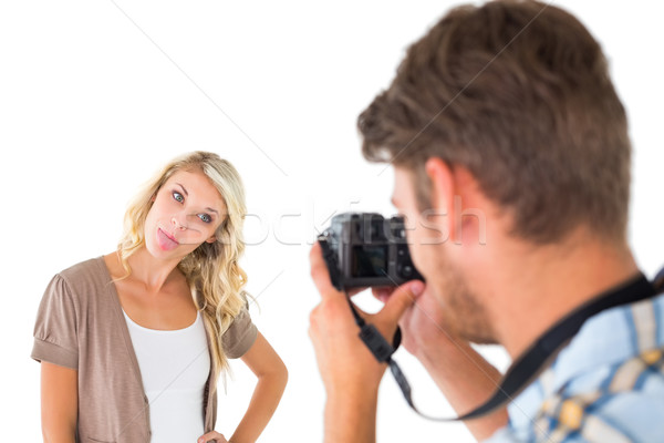 Man taking photo of his girlfriend sticking her tongue out Stock photo © wavebreak_media