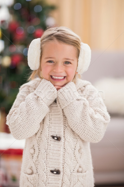 Festive little girl smiling at camera Stock photo © wavebreak_media