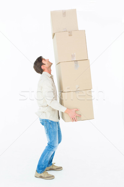 Courier man balancing cardboard boxes Stock photo © wavebreak_media