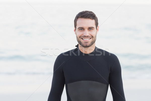 Man in wetsuit on a sunny day Stock photo © wavebreak_media