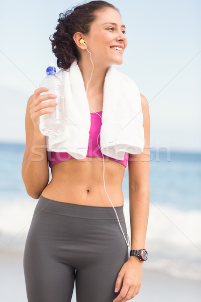 Stock photo: Pretty fit woman holding water bottle 