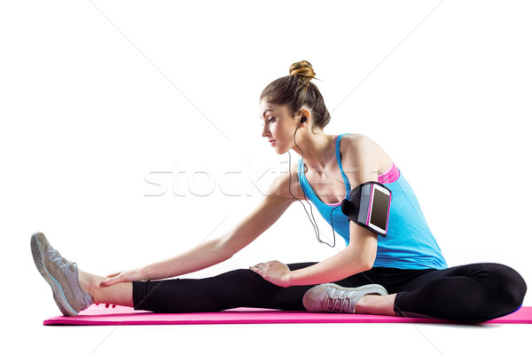 Fit woman stretching on exercise mat Stock photo © wavebreak_media