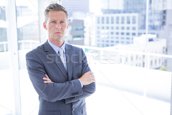 Pensando empresário olhando câmera escritório terno Foto stock © wavebreak_media
