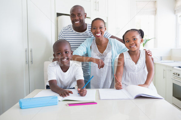 Stock photo: Portrait of a happy family looking at the camera