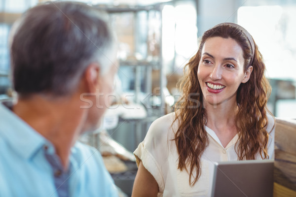 Pretty brunette smiling at her husband Stock photo © wavebreak_media