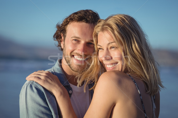 Thoughtful couple hugging at beach Stock photo © wavebreak_media