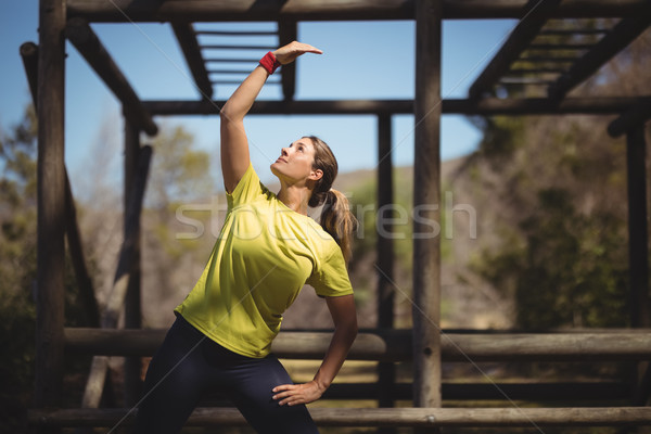 Woman exercising during obstacle course Stock photo © wavebreak_media