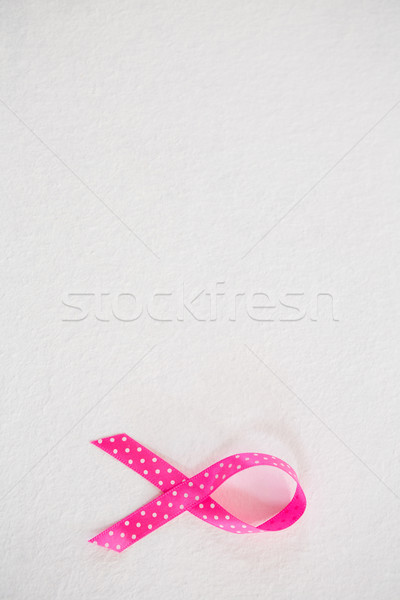 Overhead view of spotted pink Breast Cancer Awareness ribbon Stock photo © wavebreak_media