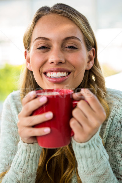 Young girl drink her coffee Stock photo © wavebreak_media