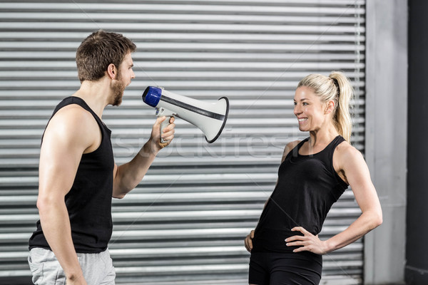 Entraîneur mégaphone crossfit gymnase femme [[stock_photo]] © wavebreak_media