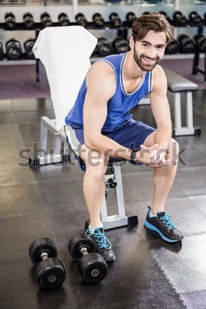 Athletic man working out helped by trainer woman Stock photo © wavebreak_media