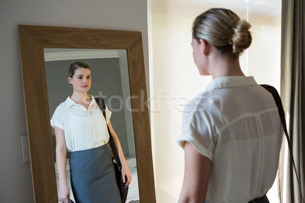 Woman getting ready for office in bedroom Stock photo © wavebreak_media