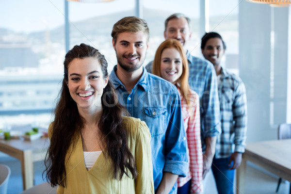 Happy creative business team standing in a line Stock photo © wavebreak_media