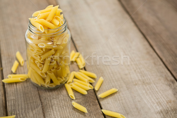 Glass jar filled with pinnate pasta Stock photo © wavebreak_media