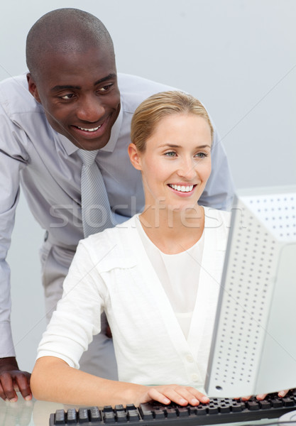 Ethnic businessman and his colleague working at a computer Stock photo © wavebreak_media