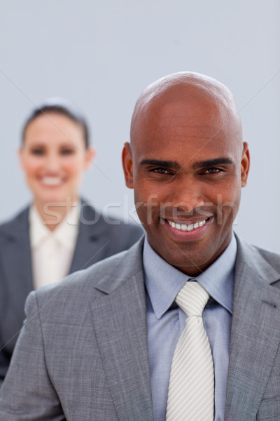 Stock photo: Focus on an attractive ethnic businessman smiling 