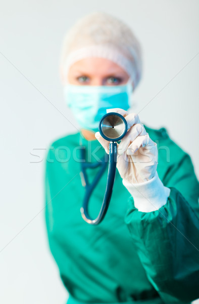 Female Suregon holding stethoscope outwards with focus on the st Stock photo © wavebreak_media