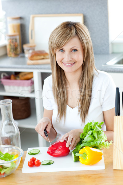 Teen woman preparing a salad in the kitchen  Stock photo © wavebreak_media