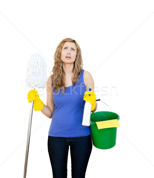 Unhappy woman with cleaning utensils against wihite background Stock photo © wavebreak_media