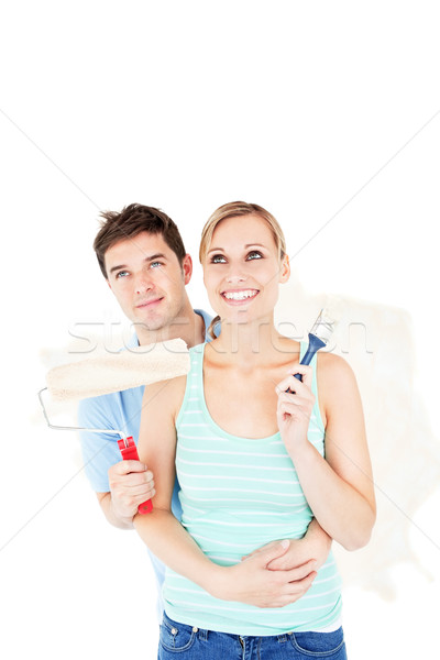 Affectionate caucasian couple painting a room in their new house Stock photo © wavebreak_media