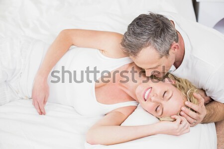 Man kissing his fiance in their bedroom Stock photo © wavebreak_media