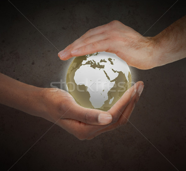 Hands protecting a glowing planet globe against a white background Stock photo © wavebreak_media