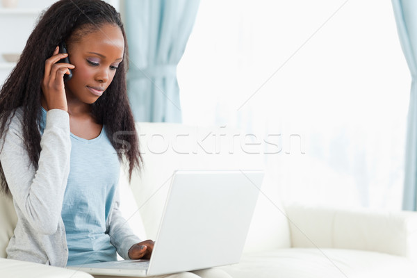 Fiatal nő telefon notebook internet laptop kommunikáció Stock fotó © wavebreak_media