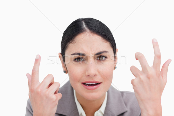 Close up of confused looking businesswoman against a white background Stock photo © wavebreak_media