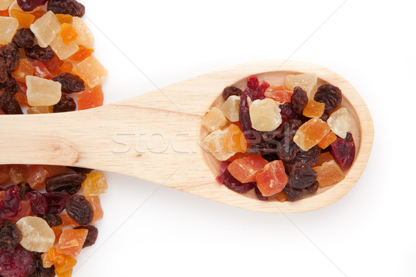 Wooden spoon with dried fruit against a white background Stock photo © wavebreak_media