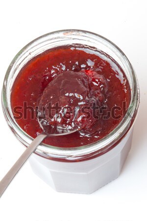 Jar of jam  and spoon against a white background Stock photo © wavebreak_media