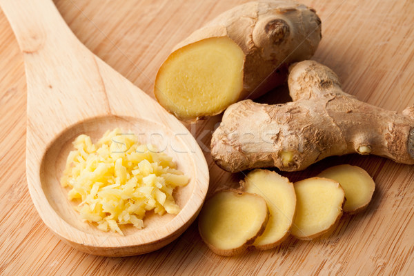 Different forms of ginger against a wood worktop Stock photo © wavebreak_media