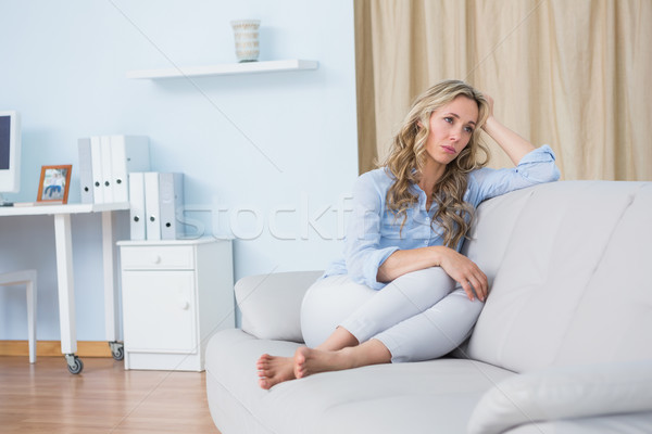 Sarışın kadın oturma kanepe düşünme ev oturma odası Stok fotoğraf © wavebreak_media